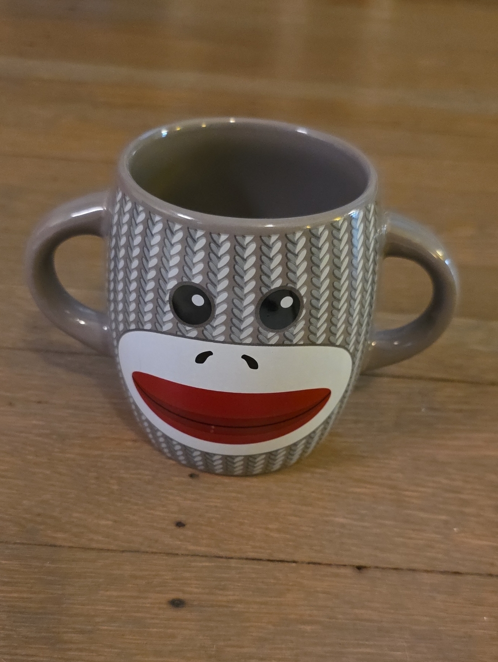 Gray Sock Monkey Double-Handle Ceramic Mug with Red Accent and Playful Face